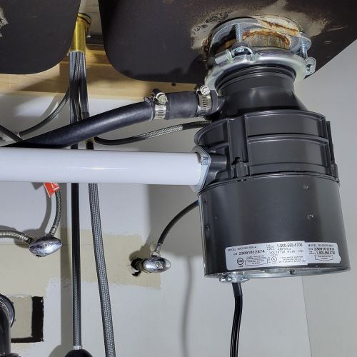 Garbage disposer under kitchen sink
