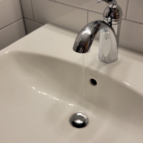 Bathroom sink with dripping faucet