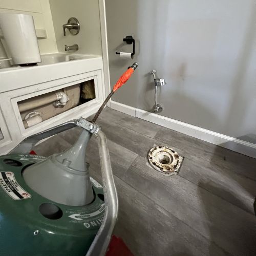 Toilet removed to allow access for a drain snake