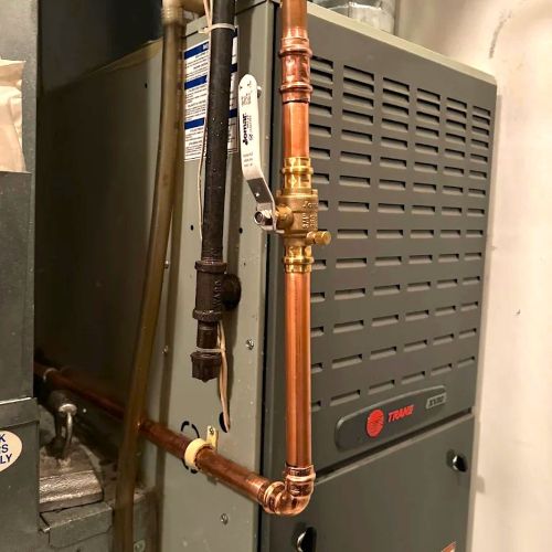 Trane furnace paired with a Jomar ball valve on a copper pipe