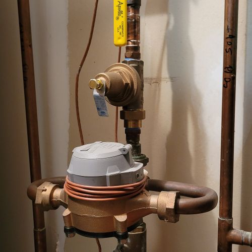 Pipe showing pressure regulator and water meter